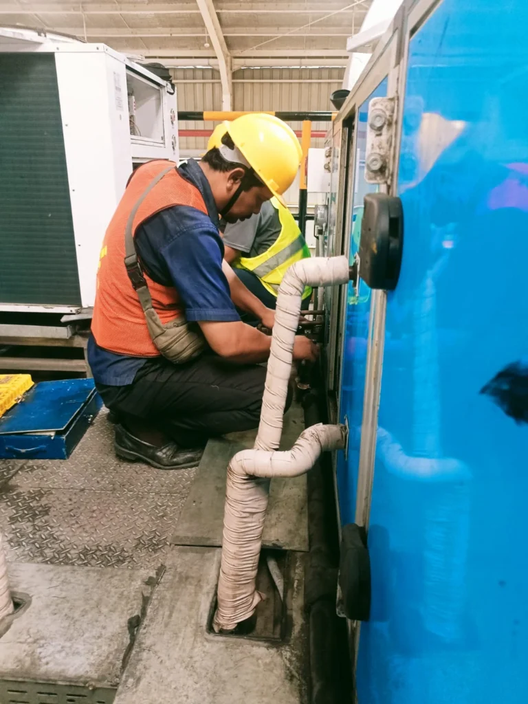 perbaikan AHU di pabrik Aqua